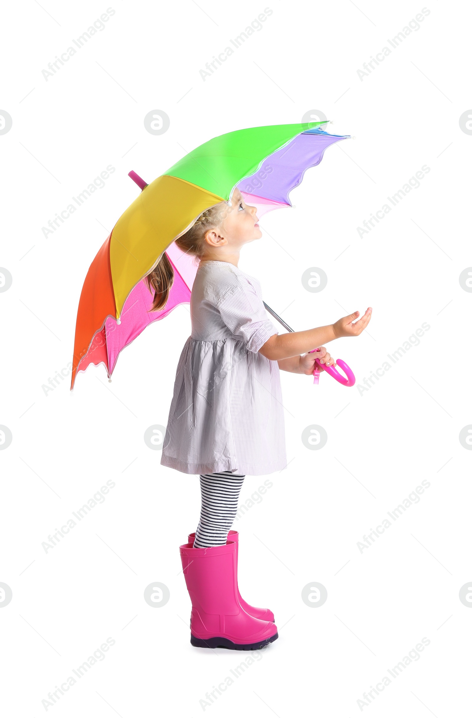 Photo of Little girl with rainbow umbrella on white background