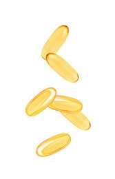 Image of Vitamin. Softgel capsules falling on white background