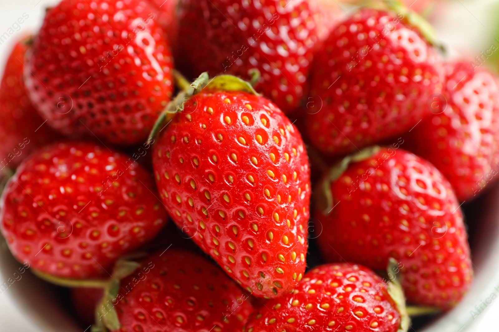 Photo of Bowl with fresh ripe strawberries, closeup. Healthy diet