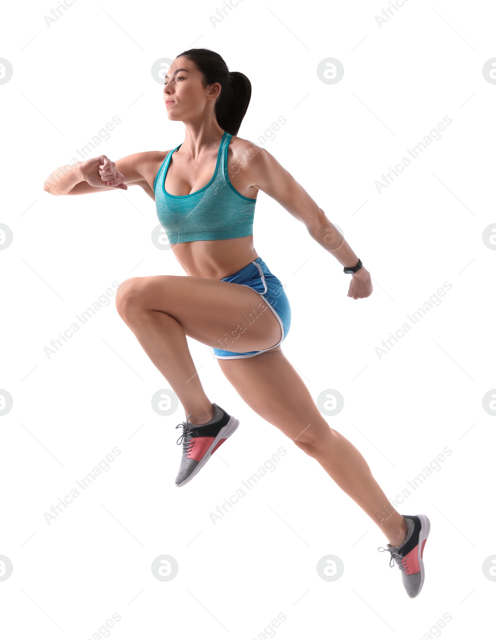 Photo of Athletic young woman running on white background, side view