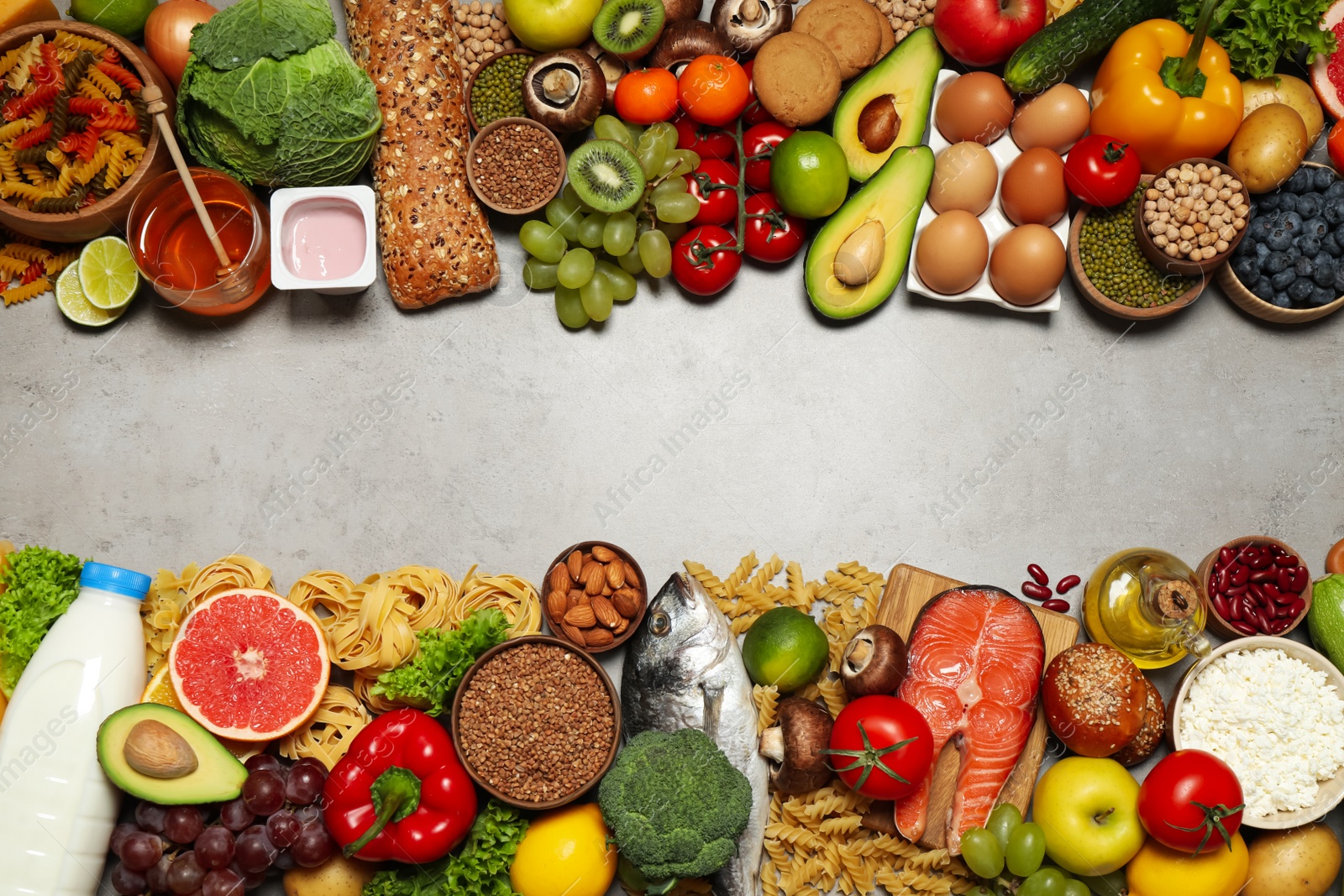 Photo of Different food products on light grey table, flat lay with space for text. Healthy balanced diet