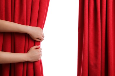 Photo of Woman opening red front curtains on white background, closeup