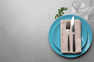 Photo of Elegant table setting on grey background, top view. Space for text