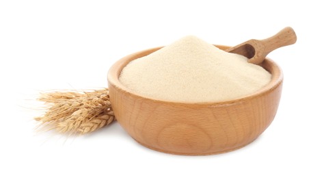 Photo of Semolina and scoop in wooden bowl on white background