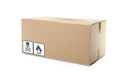 Photo of Cardboard box with different packaging symbols isolated on white. Parcel delivery