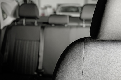 Car seat with grey upholstery, closeup view