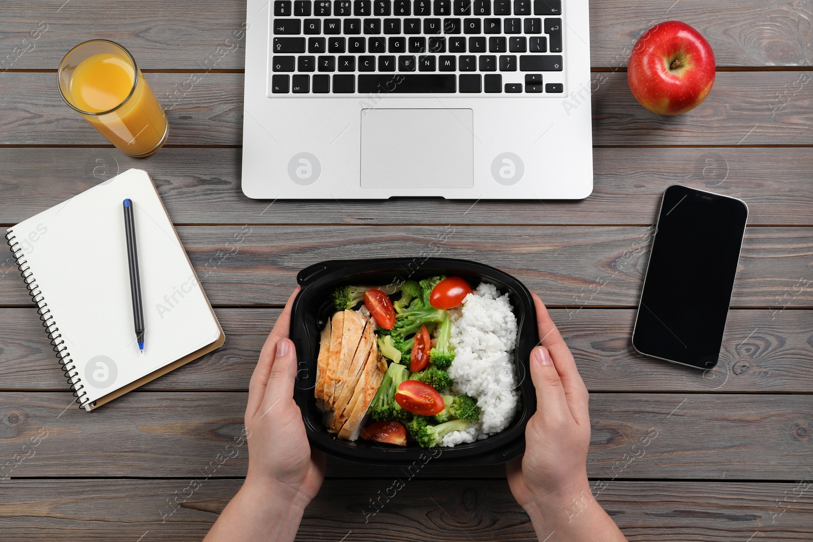 Photo of Office employee having business lunch at workplace, top view