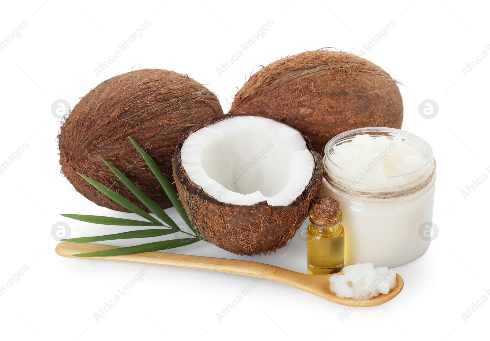 Photo of Organic coconut cooking oil, fresh fruits, wooden spoon and green leaf isolated on white