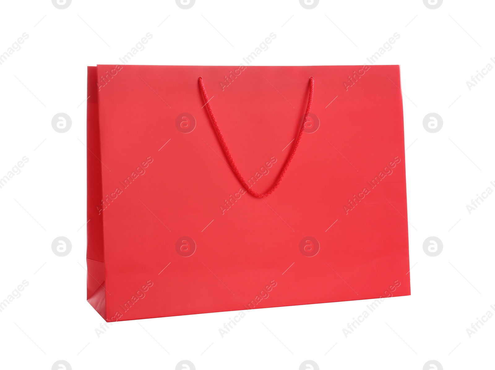 Photo of Red paper shopping bag isolated on white