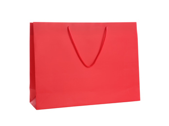 Photo of Red paper shopping bag isolated on white