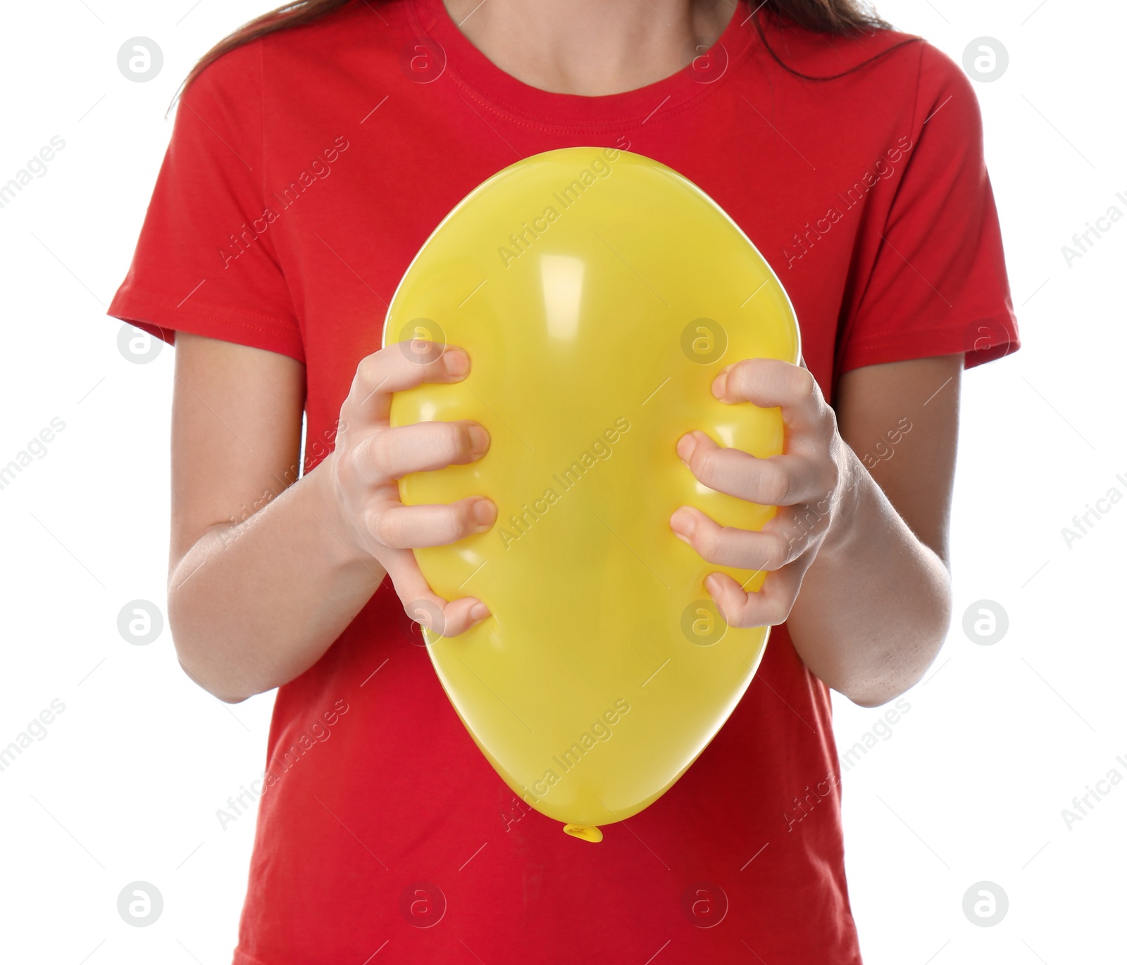 Photo of Woman squeezing yellow balloon on white background, closeup