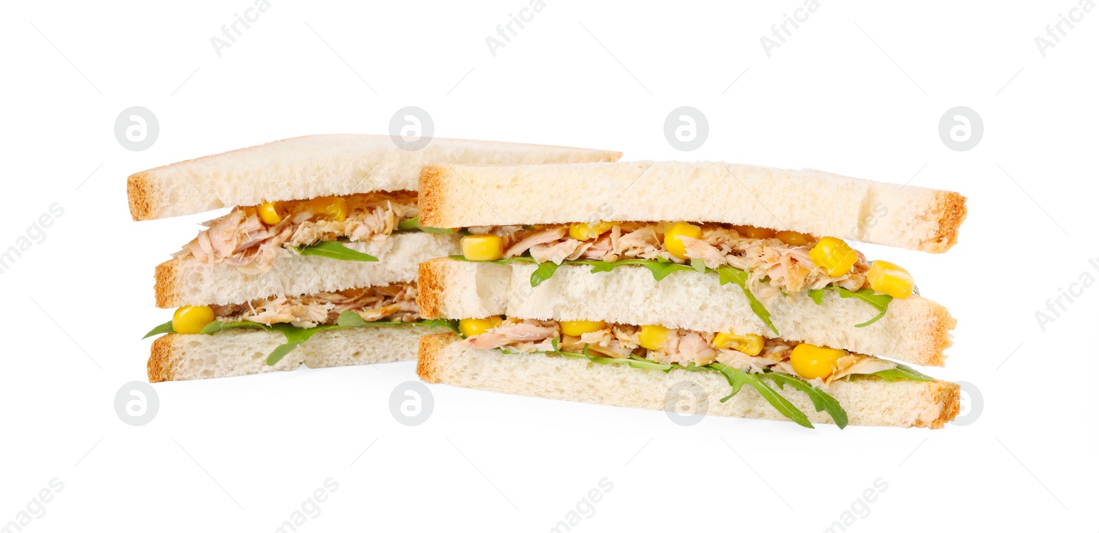 Photo of Delicious sandwiches with tuna, corn and greens on white background