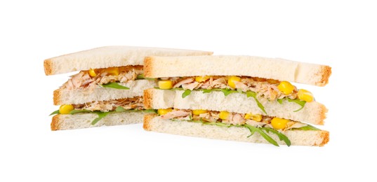 Photo of Delicious sandwiches with tuna, corn and greens on white background