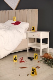Photo of Crime scene markers and evidences in bedroom