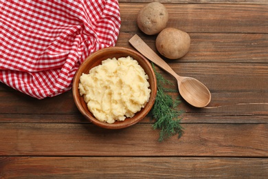 Photo of Flat lay composition with mashed potatoes on wooden background