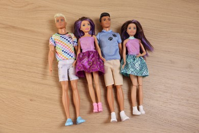 Leiden, Netherlands - September 20, 2023: Beautiful Barbie and Ken dolls on wooden table, flat lay