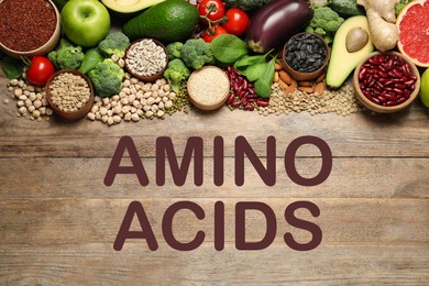 Image of Different vegetables, seeds and fruits on wooden table, flat lay. Sources of essential amino acids  