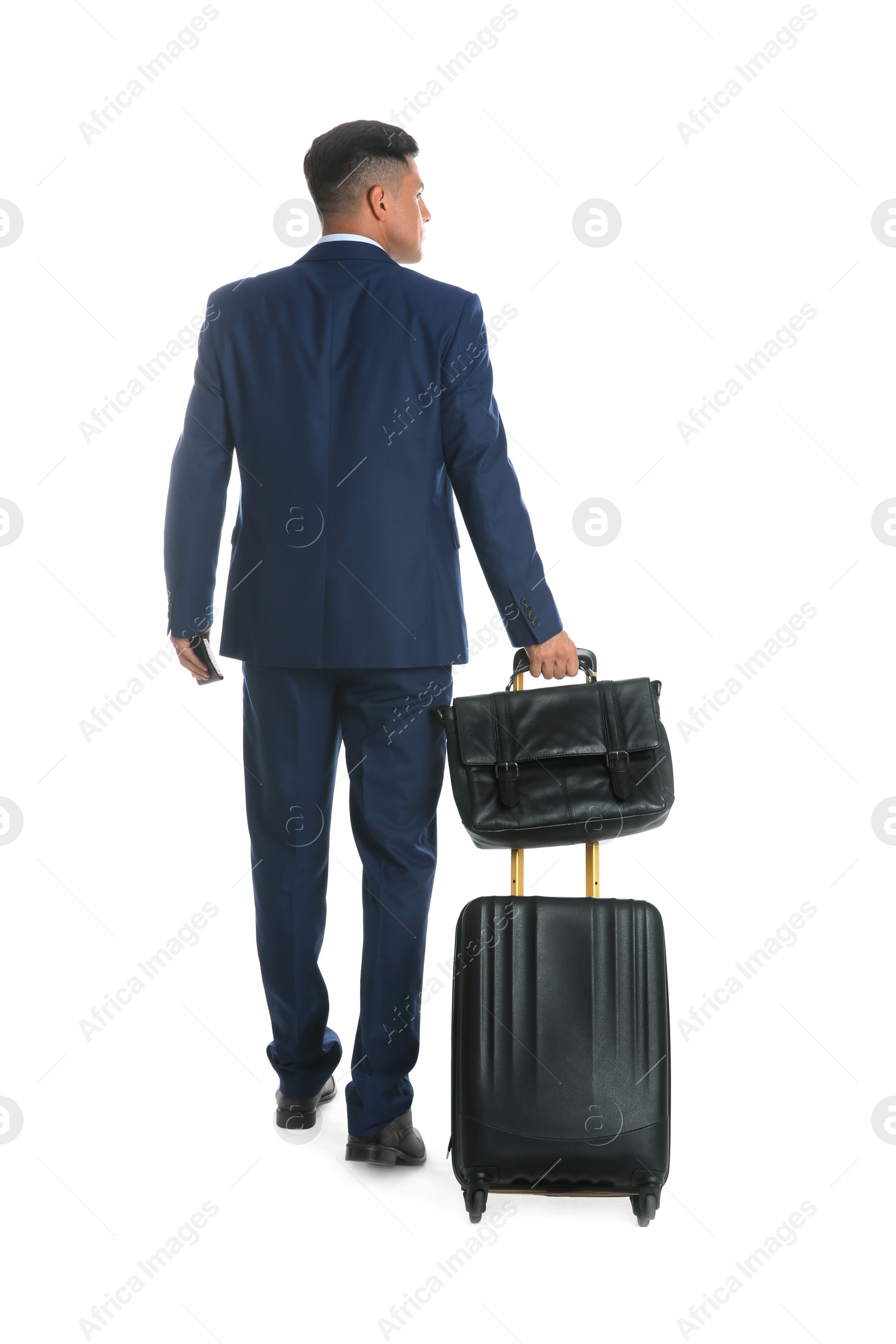 Photo of Businessman with suitcase and bag for vacation trip on white background, back view. Summer travelling