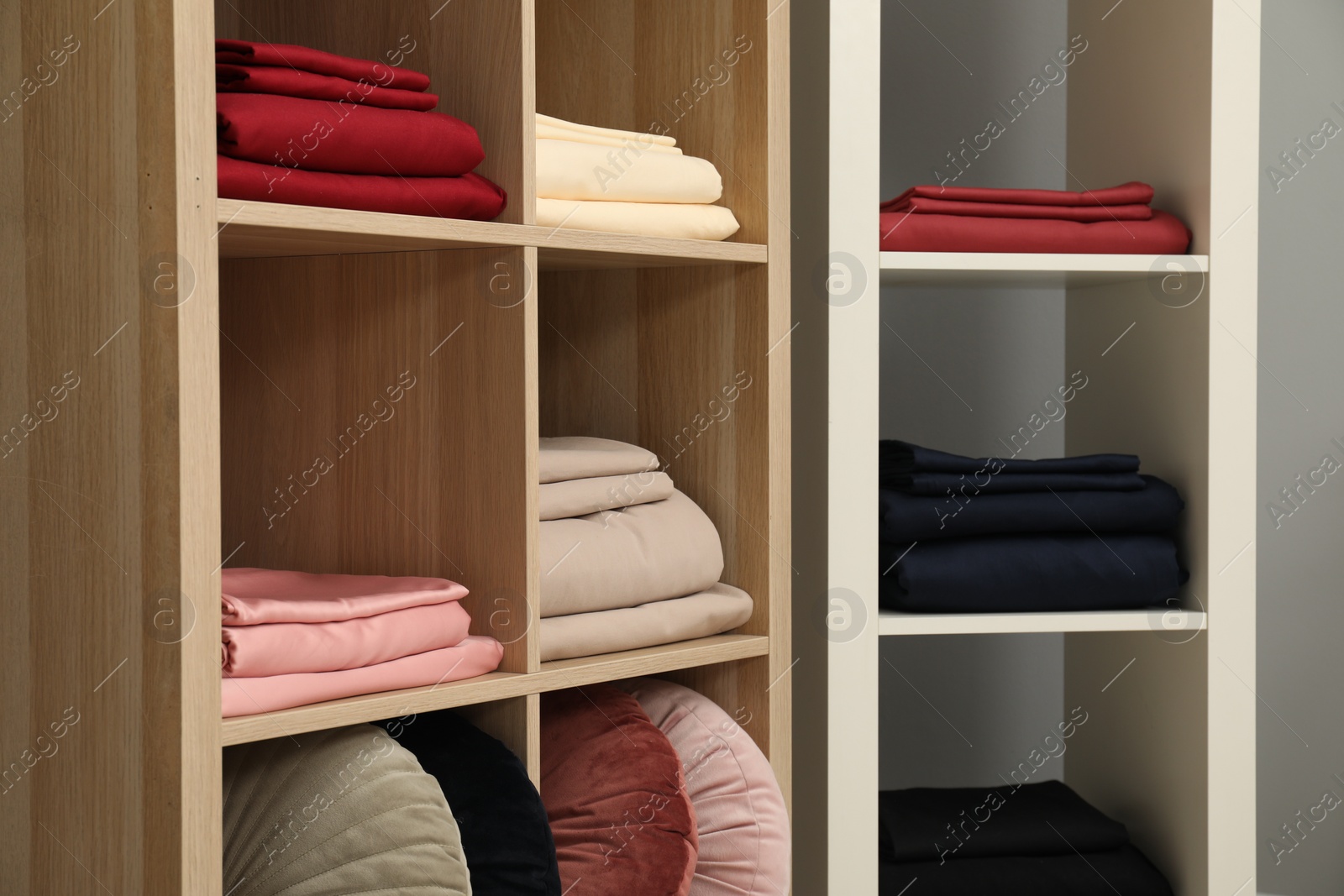 Photo of Different colorful bed linens on display in home textiles store