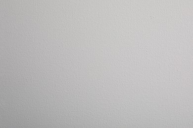 Photo of Blank white canvas as background, closeup view