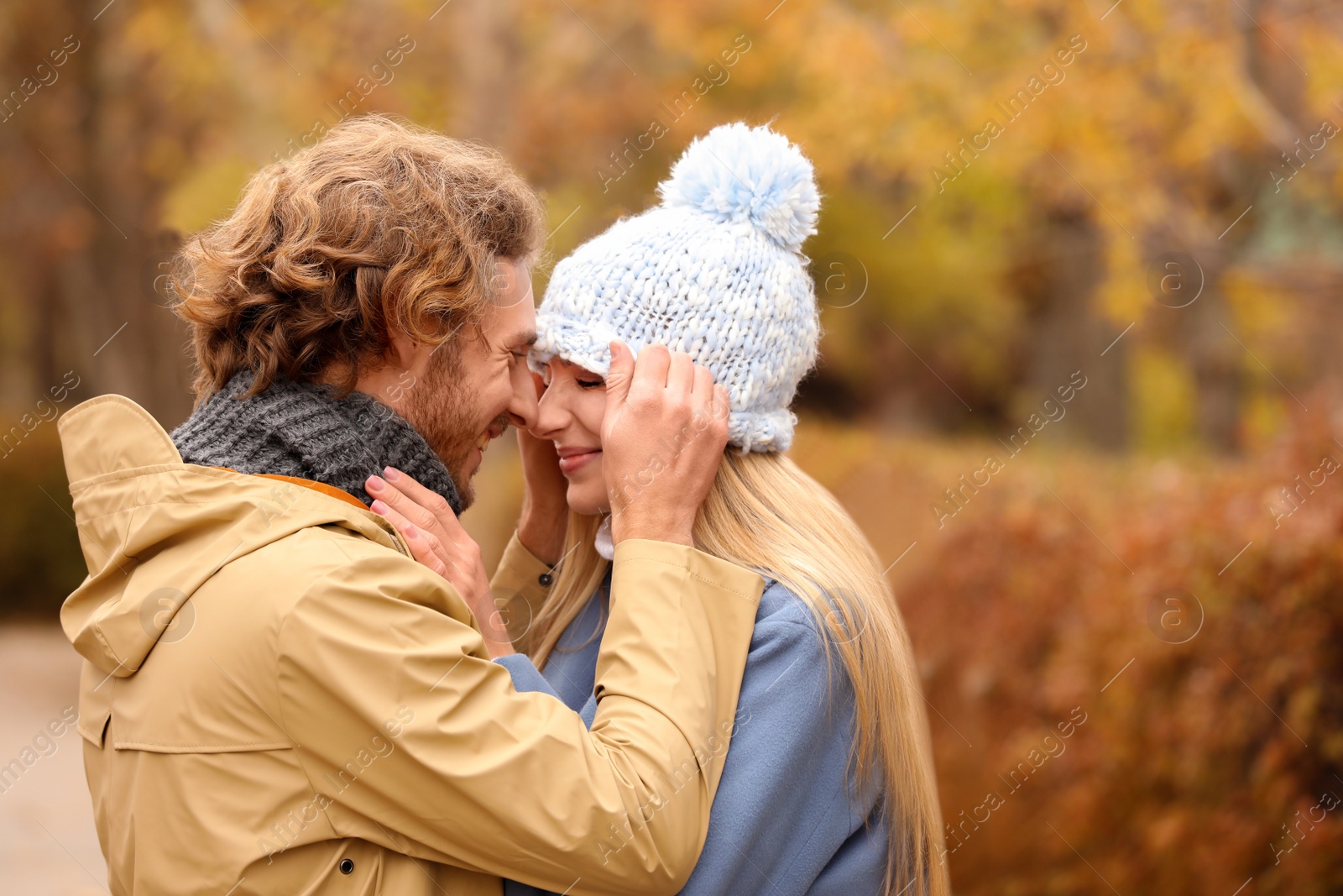 Photo of Young romantic couple in park on autumn day