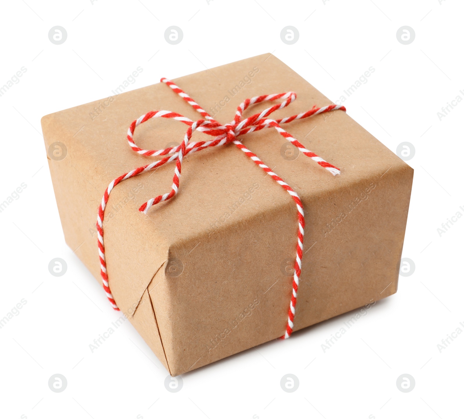 Photo of Gift box wrapped in kraft paper with bow isolated on white