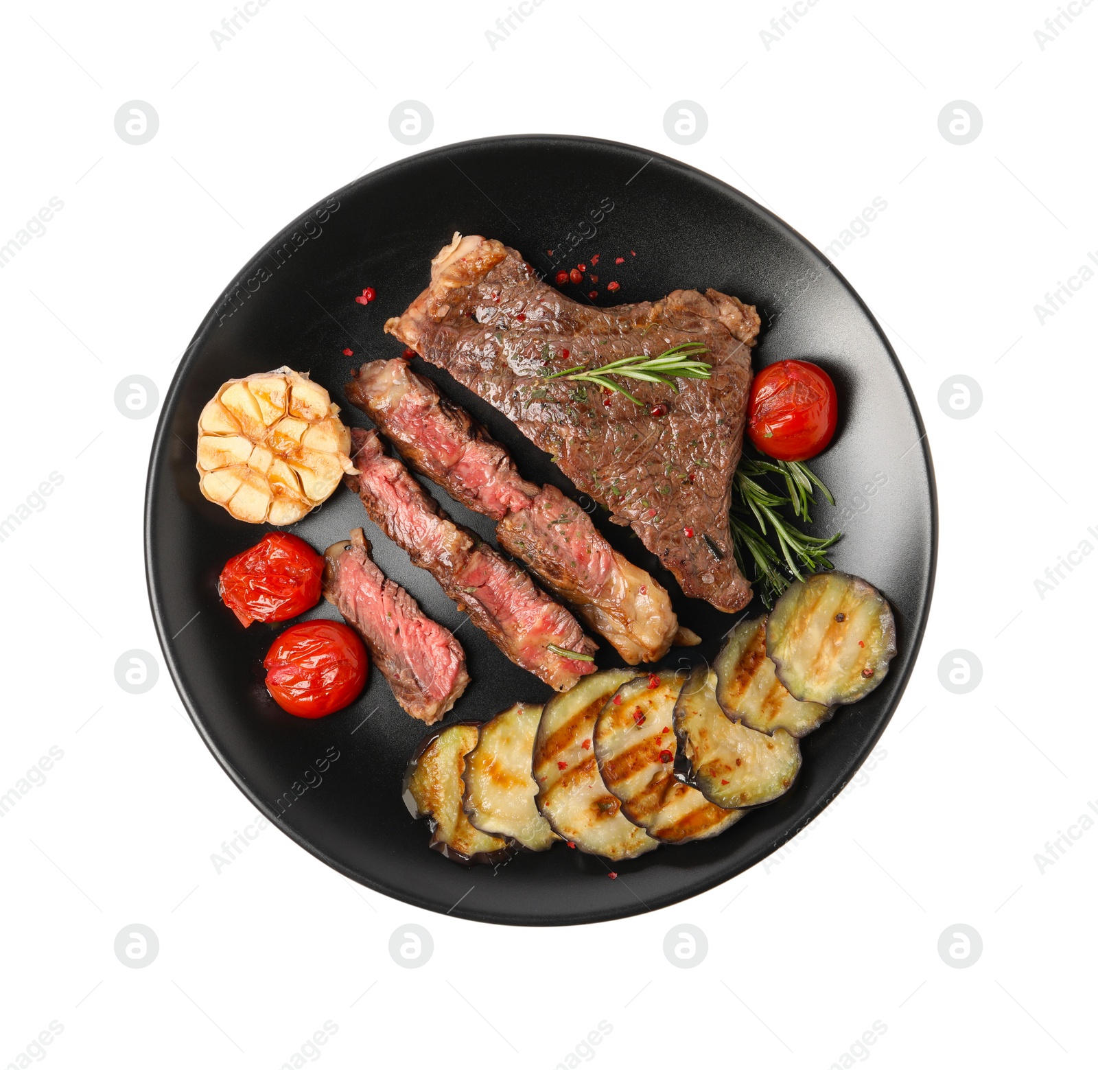 Photo of Delicious grilled beef steak with vegetables and spices isolated on white, top view