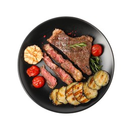 Delicious grilled beef steak with vegetables and spices isolated on white, top view