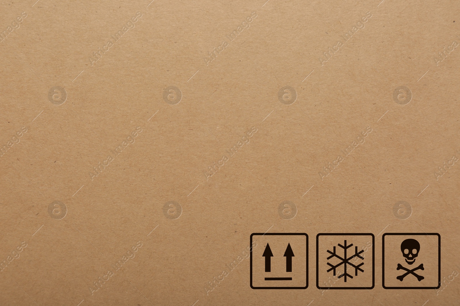 Image of Cardboard box with packaging symbols as background, closeup