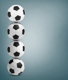 Image of Stack of soccer balls on dusty light blue background. Space for text