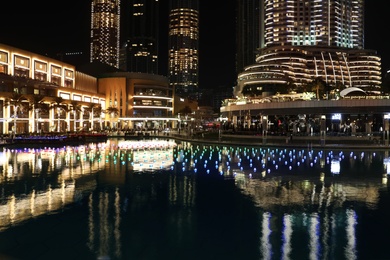 Photo of DUBAI, UNITED ARAB EMIRATES - NOVEMBER 04, 2018: Night cityscape with illuminated buildings