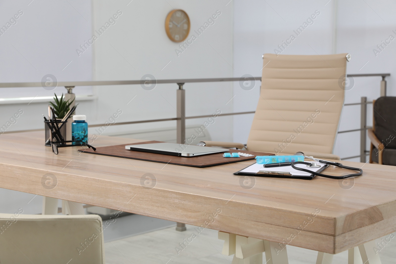 Photo of Modern doctor's workplace in office. Interior design