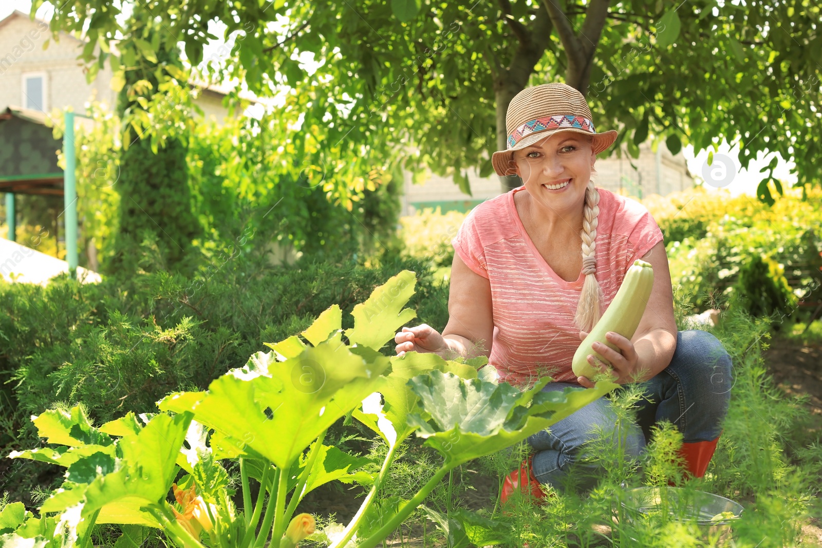 Photo of Woman working in garden on sunny day