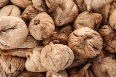 Tasty figs as background, top view. Healthy dried fruit