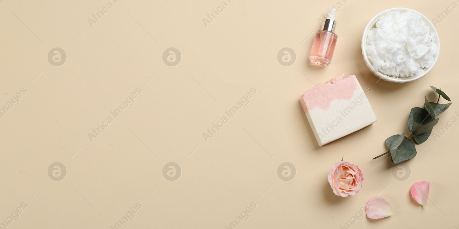 Photo of Flat lay composition with natural handmade soap and ingredients on beige background. Space for text