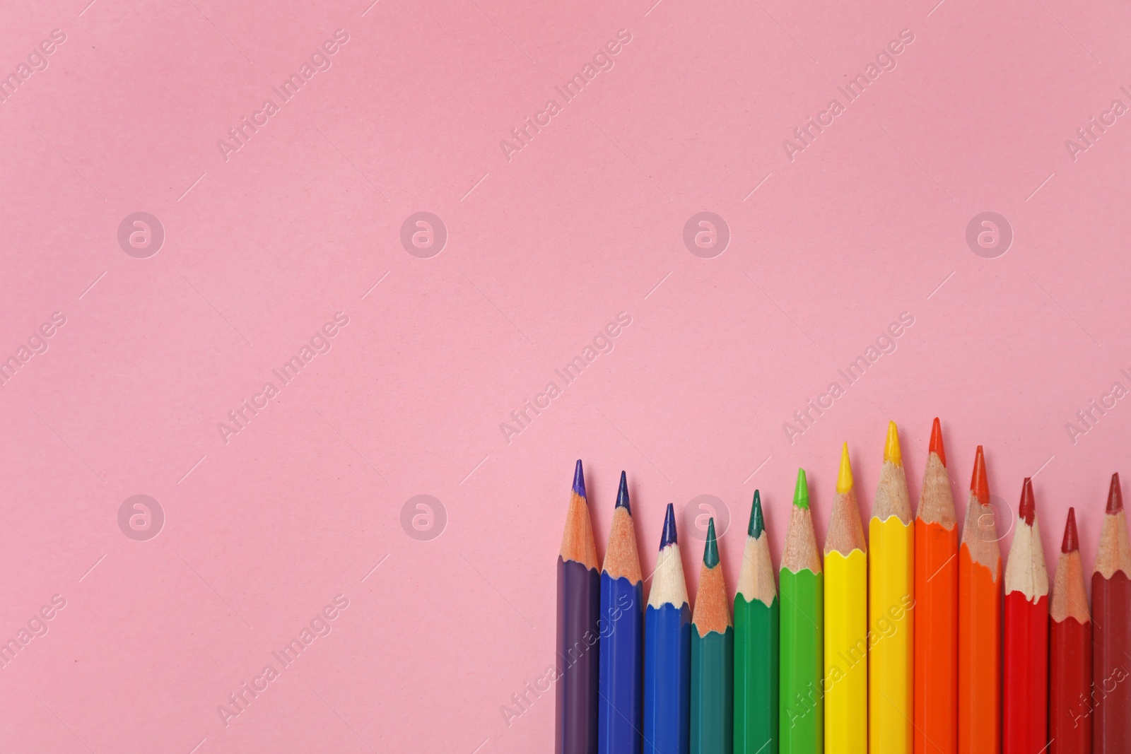 Photo of Collection of pencils on table, top view. Color palette