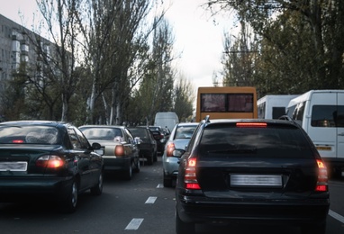 Cars in traffic jam on city street