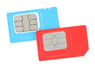 Modern SIM cards on white background, top view