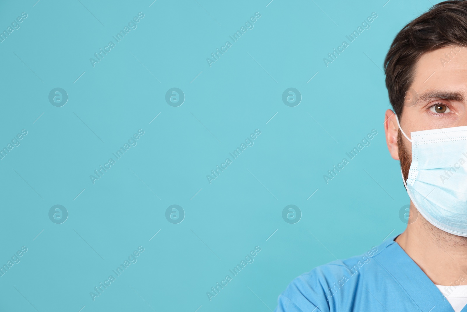 Photo of Nurse with medical mask on light blue background, closeup. Space for text