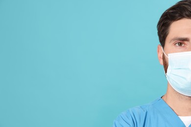 Photo of Nurse with medical mask on light blue background, closeup. Space for text