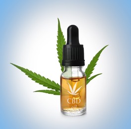 Bottle of cannabidiol tincture and hemp leaf on light blue background