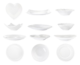 Set with empty ceramic plates and bowls on white background 