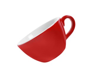 Photo of One red ceramic cup isolated on white