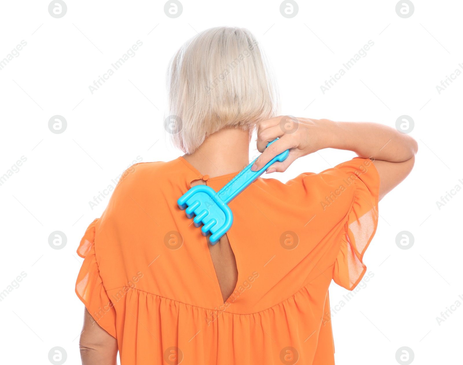 Photo of Mature woman scratching back with toy rake on white background. Annoying itch