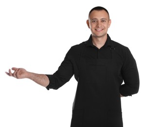 Photo of Portrait of happy young waiter in uniform on white background