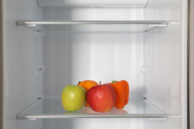 Photo of Fresh products on shelf inside modern refrigerator