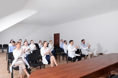 Photo of Teamdoctors in meeting room during medical conference