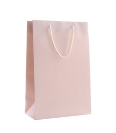 Photo of Pink paper shopping bag isolated on white