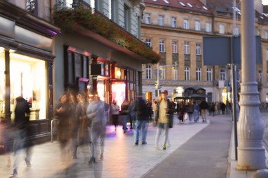 Photo of People walking on city street, long exposure effect