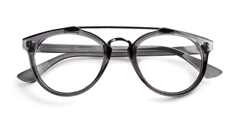 Photo of Glasses with corrective lenses on white background. Vision problem